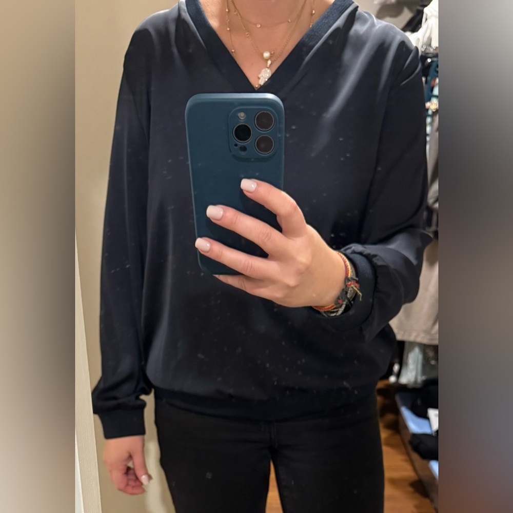 Beautiful top from a famous French brand. Navy blue silky material in size M.